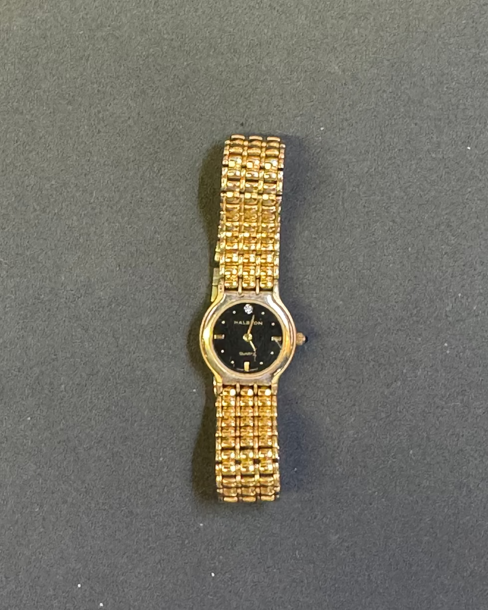 Vintage halston black face gold tone ladies watch