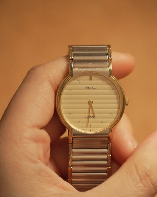 1986 Seiko ARC two tone round dial quartz watch 5p30-6a70