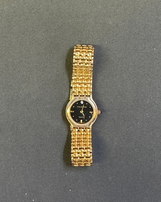 Vintage halston black face gold tone ladies watch