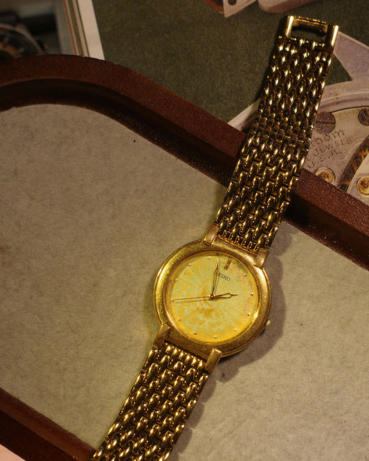1985 Seiko earth gold tone oxidize quartz watch v701-1761